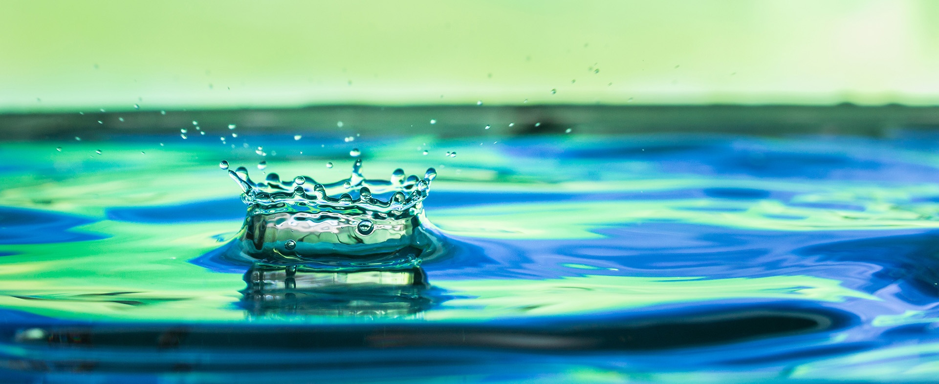 Image of drop of water landing in body of water signifying water reclamation 
