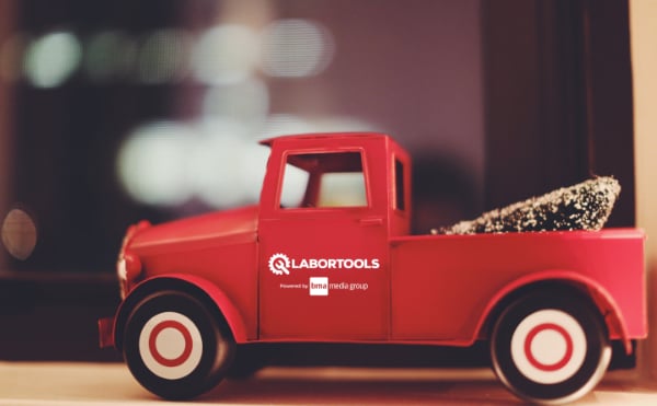 LaborTool Holiday Newsletter featuring an old pickup truck toy with a tree in its bed and a LaborTools powered by BMA Media Group sign on the door.